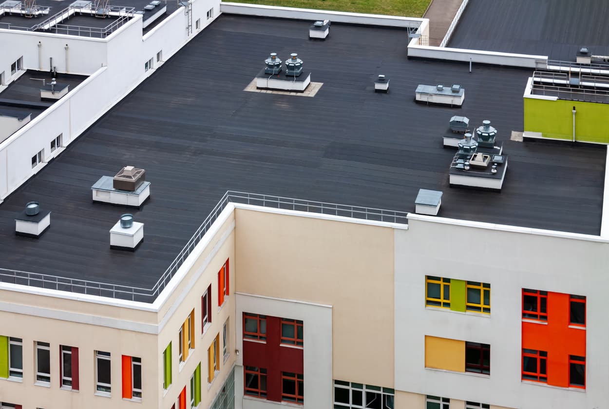 The top of a commercial building's flat top roof